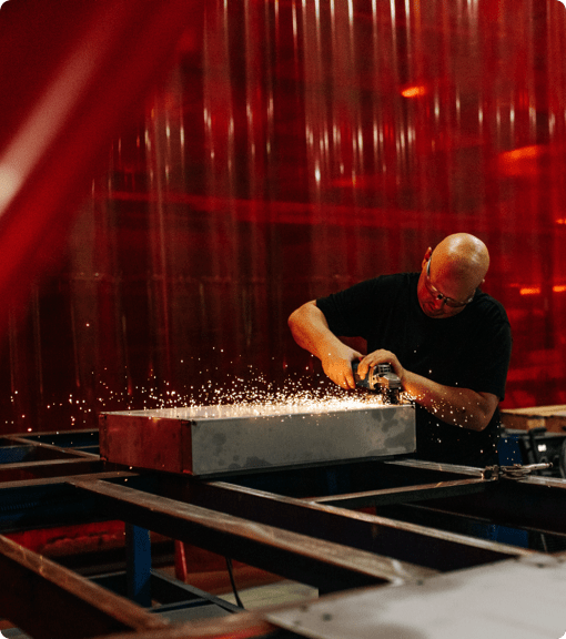 Man operating machinery to construct environmental test chambers