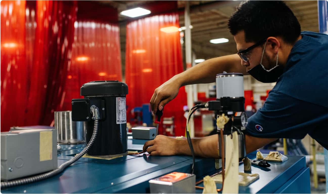 Man working at a factory that builds environmental test chambers